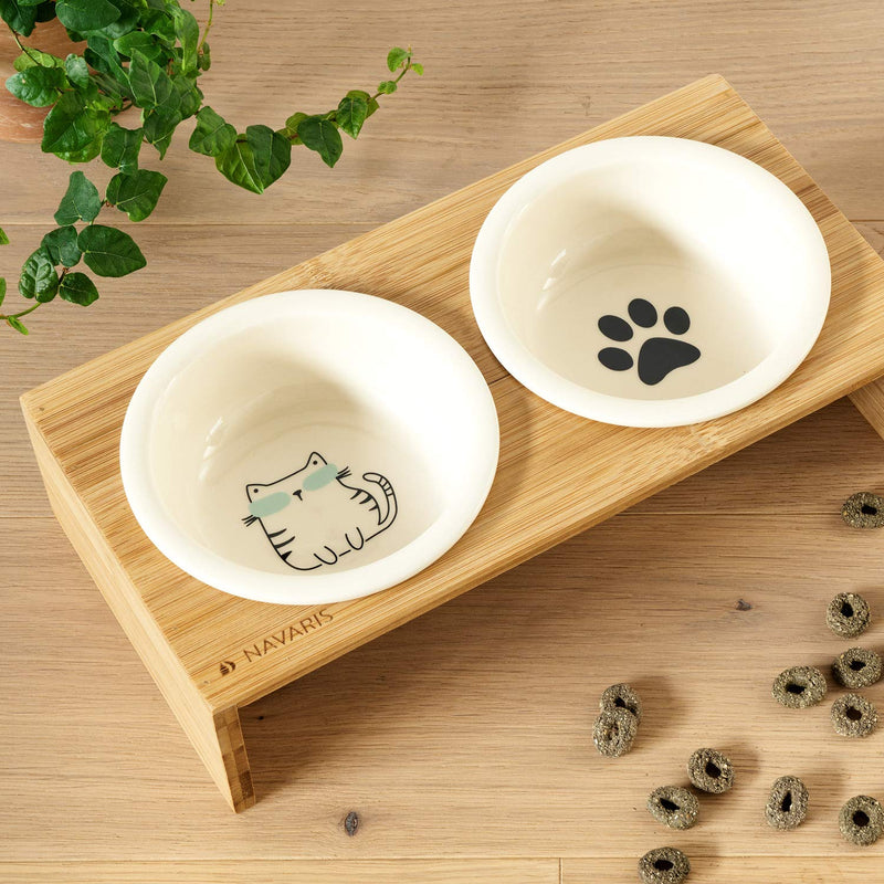 Navaris Ceramic Cat Bowls with Stand - Raised Food and Water Bowl Set for Cats on Elevated Wooden Riser - Eco-Friendly Cat and Paw Design - 2 Bowls S - PawsPlanet Australia