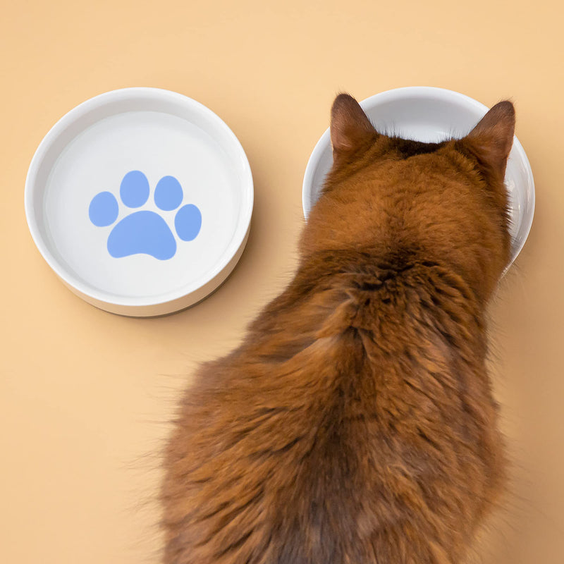 Navaris Porcelain Cat Bowls (Set of 2) - 15cm Food and Water Bowl Dishes for Pet Cats and More - With Non-Slip Silicone Bottom - Blue Paw Design - PawsPlanet Australia